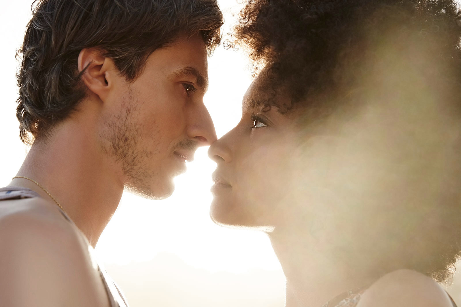 Interracial couple kissing  | Dovis Bird Agency Photography