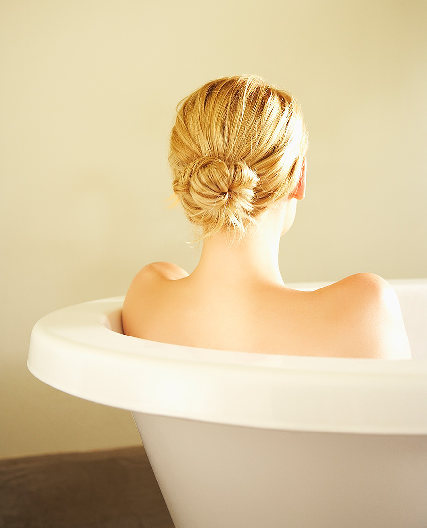 Woman taking bath in tub  | Dovis Bird Agency Photography